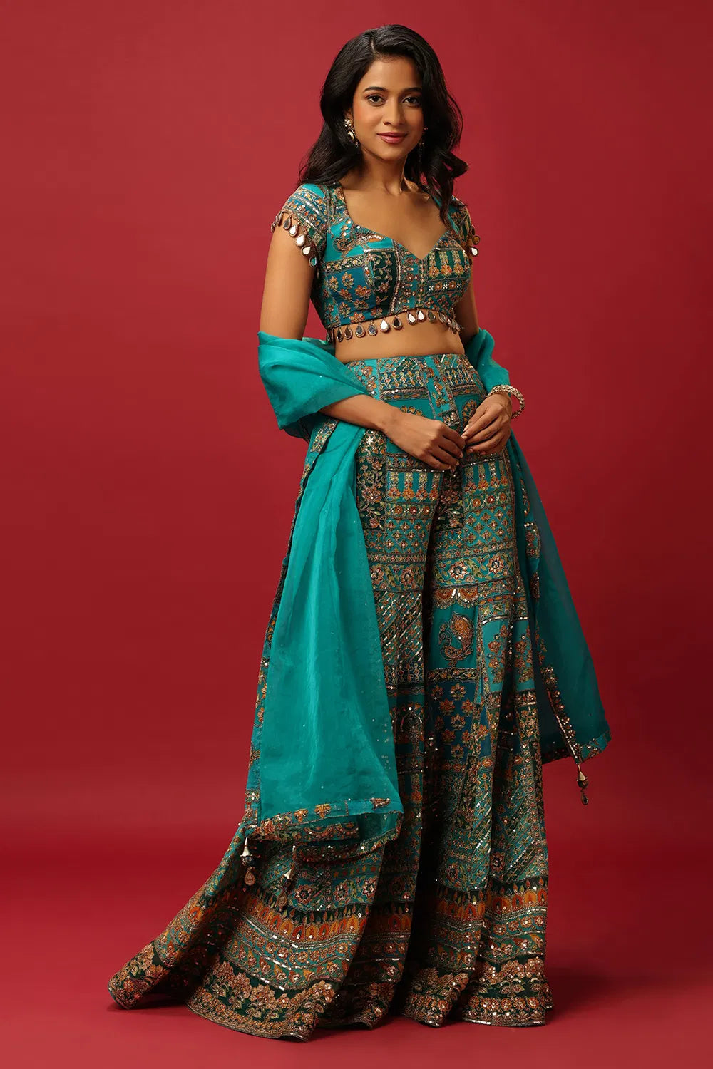 TURQUOISE BLUE SINGLE TIERED SHARARA PANT SET WITH AN ALL OVER MULTI COLOURED PRINT PAIRED WITH A MATCHING DUPATTA AND ZARI AND SEQUIN DETAILS