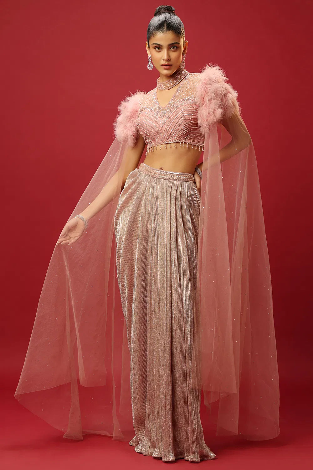 PETAL PINK DRAPED SKIRT SET AND A HAND EMBROIDERED BLOUSE WITH ATTACHED CAPE SLEEVES AND A FEATHER SHOULDER DETAIL