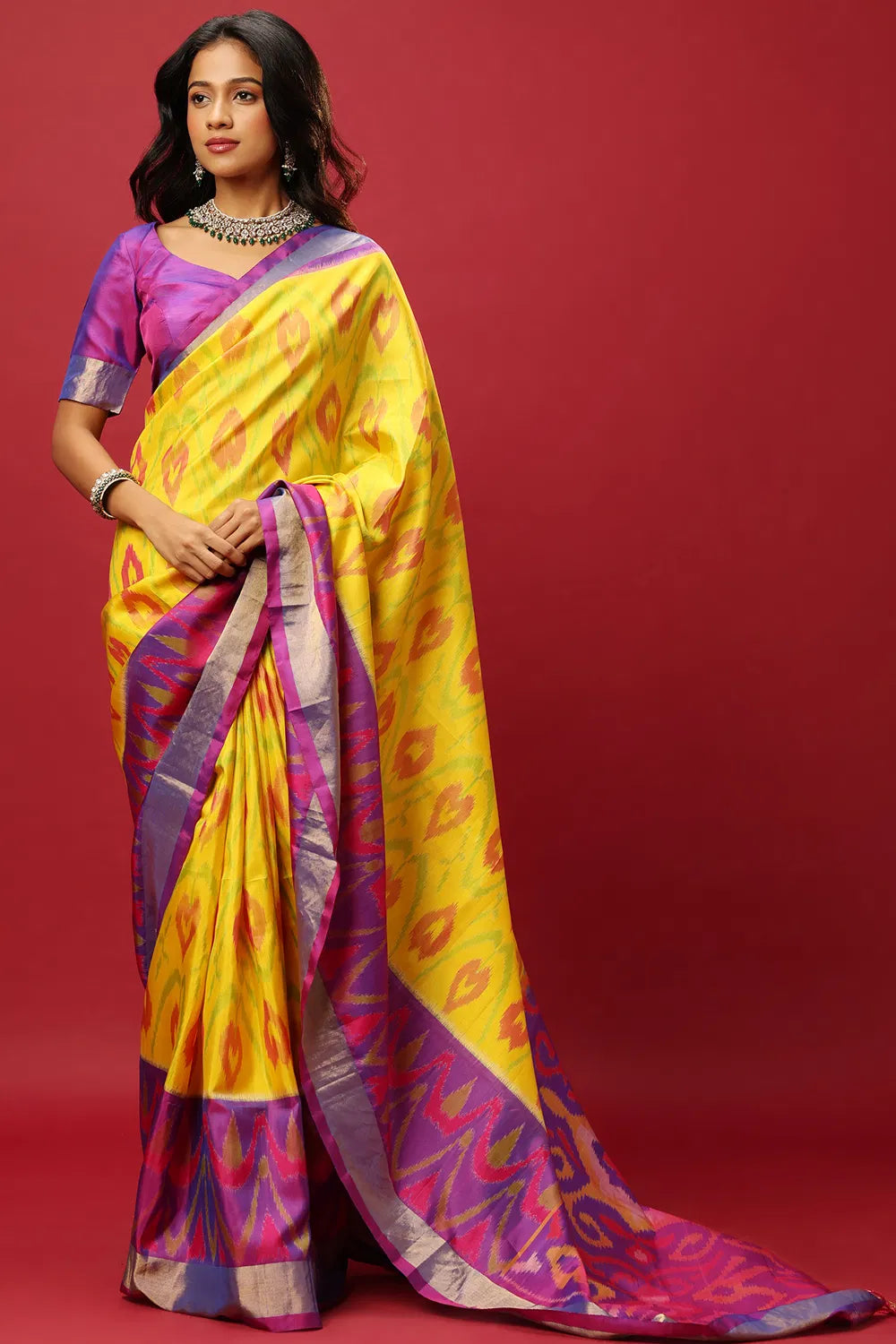 YELLOW AND PURPLE TRADITIONAL CLASSIC SAREE SET PAIRED WITH A PURPLE TWO TONED BLOUSE.