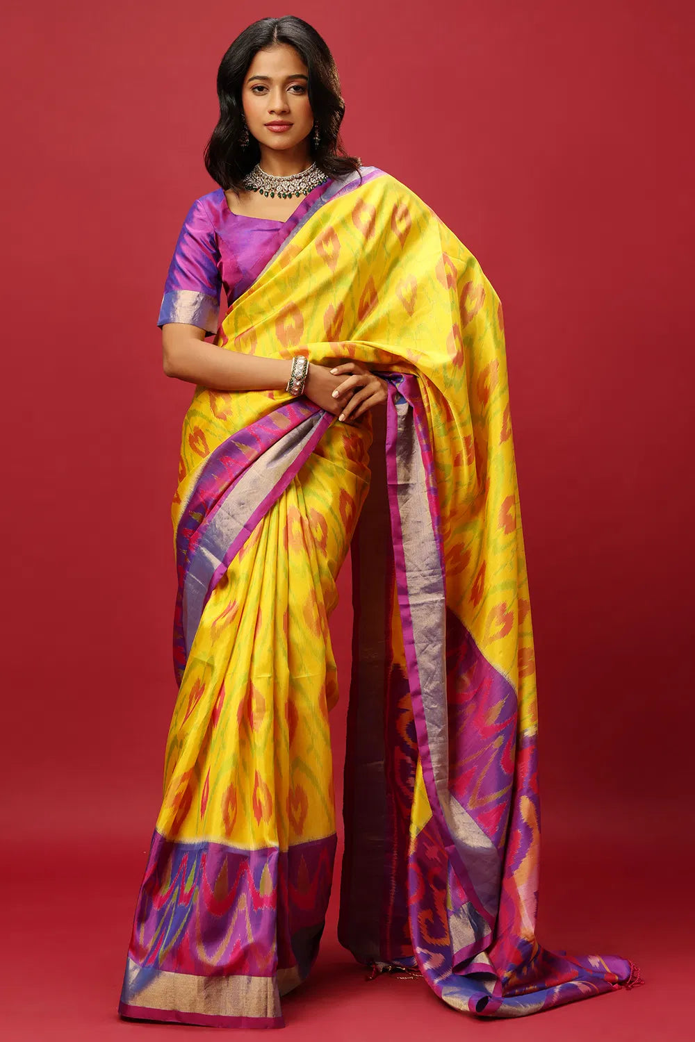 YELLOW AND PURPLE TRADITIONAL CLASSIC SAREE SET PAIRED WITH A PURPLE TWO TONED BLOUSE.