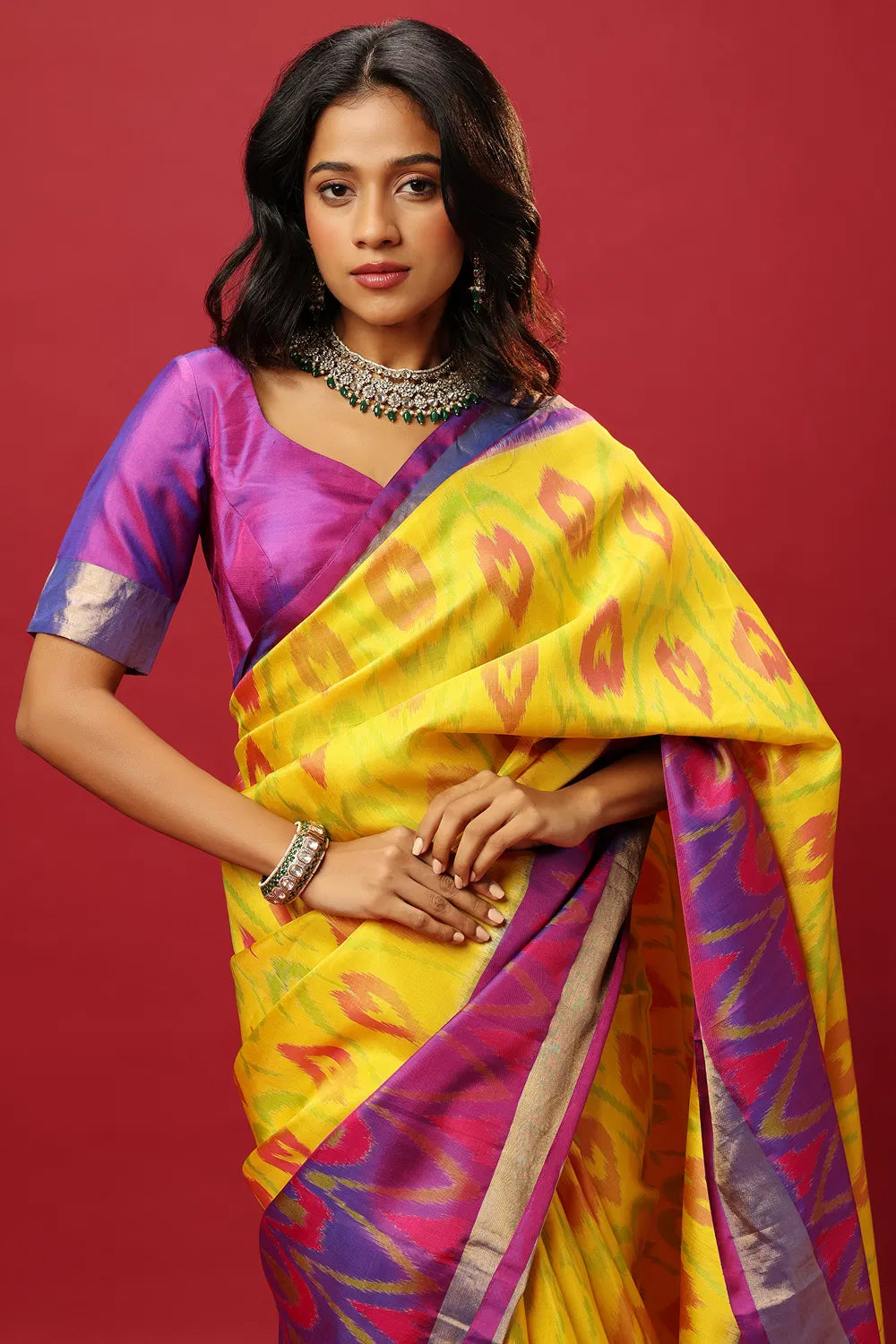 YELLOW AND PURPLE TRADITIONAL CLASSIC SAREE SET PAIRED WITH A PURPLE TWO TONED BLOUSE.