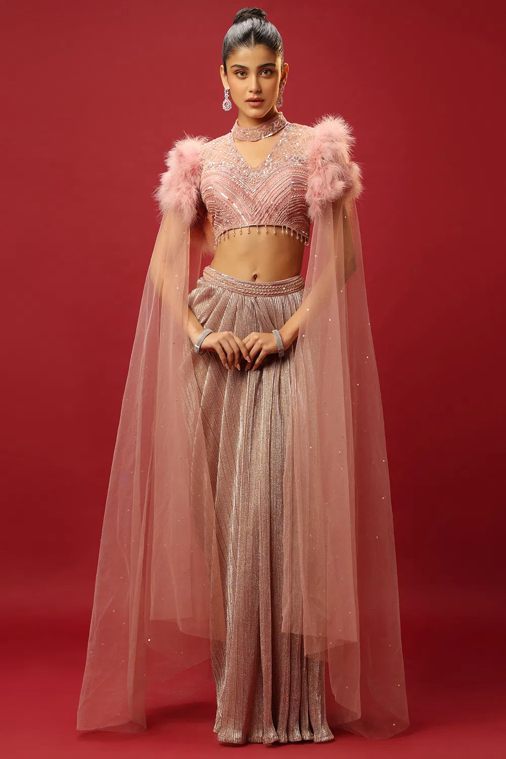 PETAL PINK DRAPED SKIRT SET AND A HAND EMBROIDERED BLOUSE WITH ATTACHED CAPE SLEEVES AND A FEATHER SHOULDER DETAIL