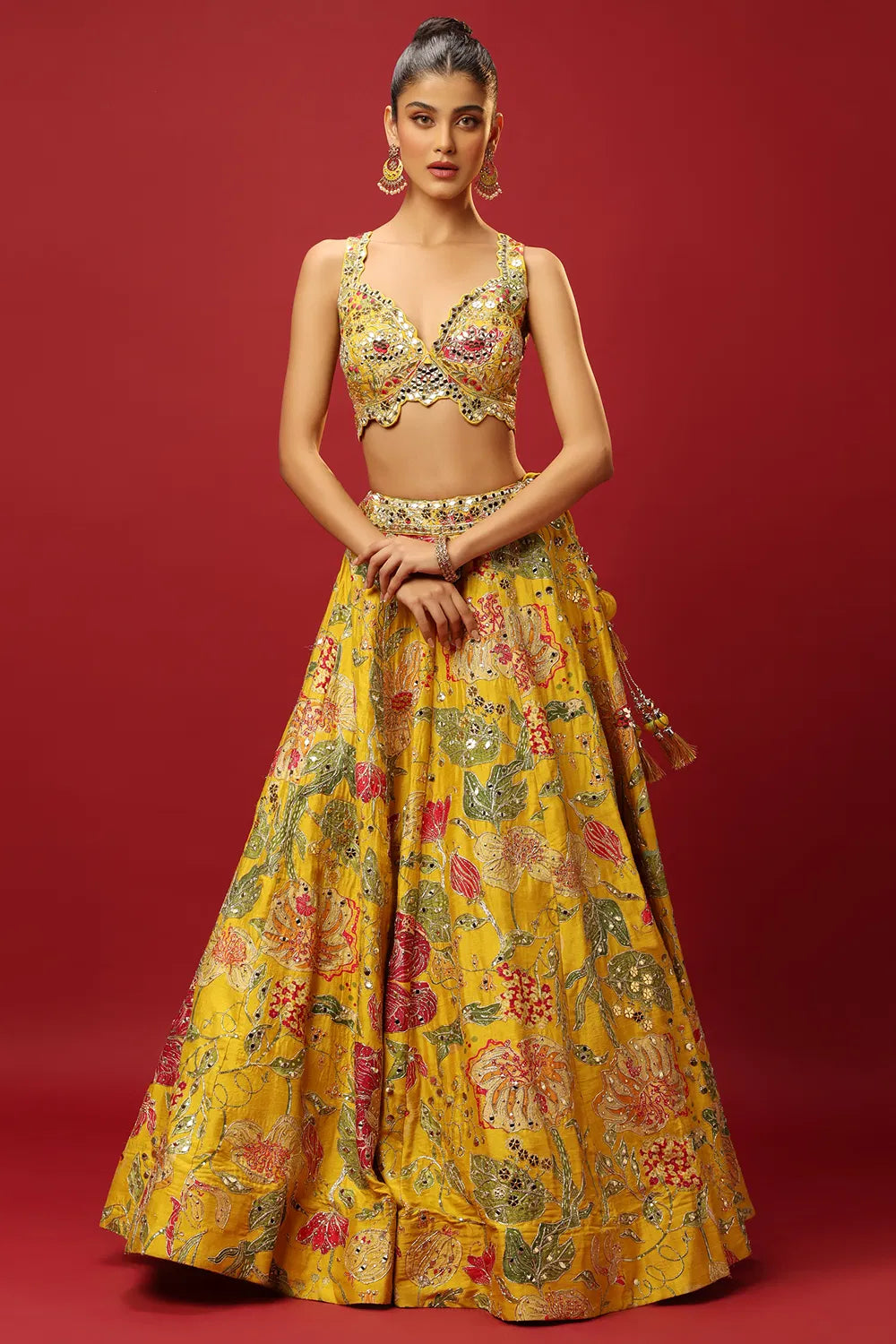 SUNSHINE YELLOW CLASSIC PRINTED LEHENGA SET AND A MIRROR WORK BLOUSE PAIRED WITH A MATCHING DUPATTA AND ALL OVER MIRROR WORK DETAILS.